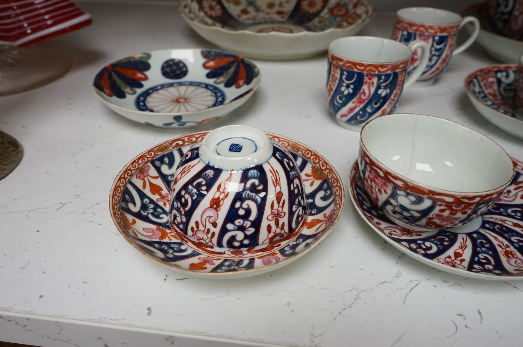 A Worcester Lord Henry Thynne type fluted tea bowl and saucer, c.1780, a group of Worcester Queen Charlotte pattern tea and coffee wares, c.1790-1810, two Worcester Kakiemon style dishes, largest 21cm in diameter